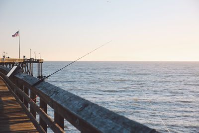 Scenic view of a pier and sea against clear sky