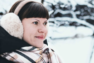 Portrait of a smiling young woman during winter