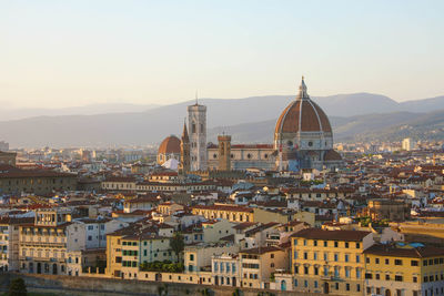 Florence city during golden sunset. panoramic view and cathedral of florence, italy.