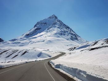 Scenic view of snowcapped mountain against sky