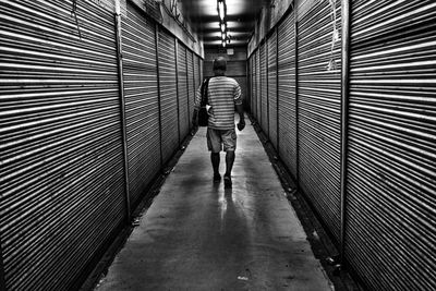 Woman walking in tunnel