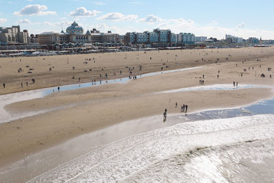 People on beach against sky