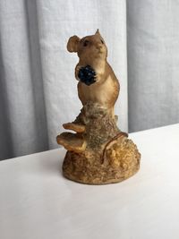 Close-up of dog statue on table