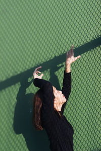 Woman standing with umbrella