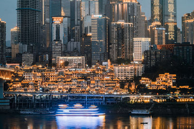 Aerial view of illuminated buildings in city