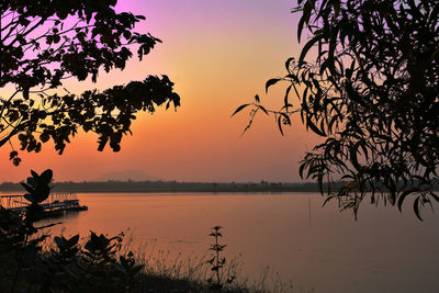 Scenic view of lake against sky during sunset