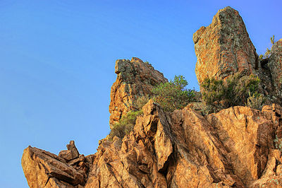 Low angle view of rock formation against clear sky