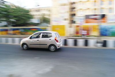 Blurred motion of car on road
