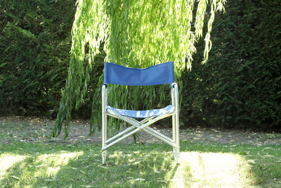 Empty chair in park