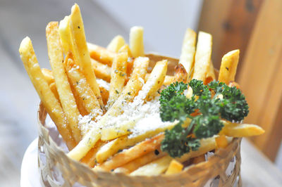 Close-up of burger and fries in plate