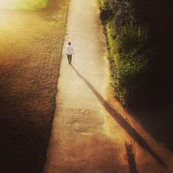 Woman walking on road