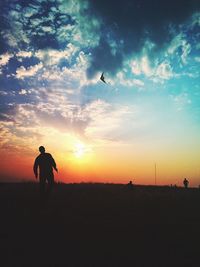 Silhouette of people at sunset