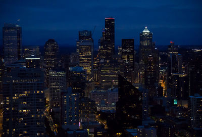 Aerial view of city lit up at night