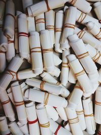 Full frame shot of rolled paper bundles