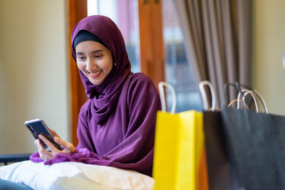 Young woman using mobile phone