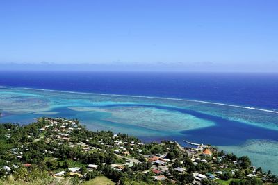 High angle view of sea against blue sky