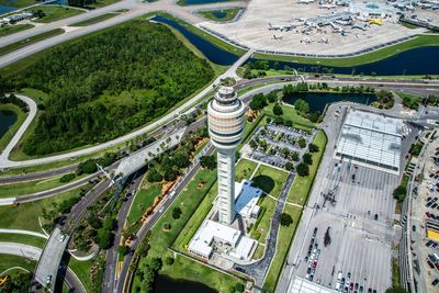 Aerial view of air traffic control tower in city