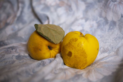 Close-up of yellow fruits on bed