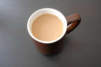 High angle view of coffee cup on table