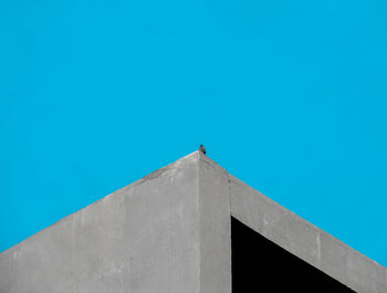 Low angle view of building against blue sky