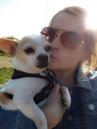 Portrait of young woman with dog