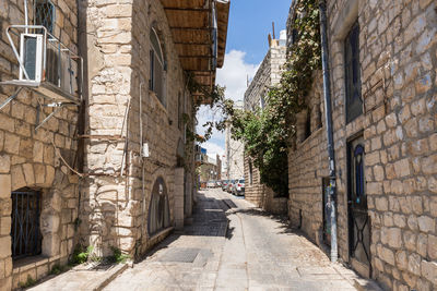 Street amidst buildings against sky