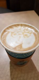 Close-up of cappuccino on table