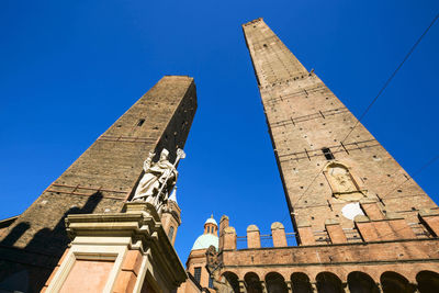 Low angle view of historic building against blue sky