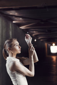 Portrait of young woman looking at camera