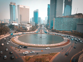 Aerial view of street amidst buildings in city