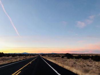 Road against sky during sunset