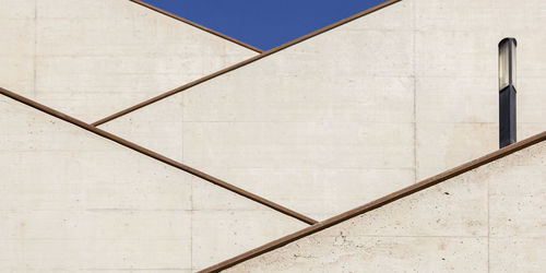 Low angle view of railing against building