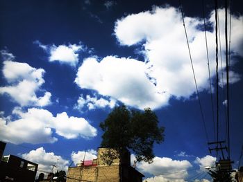 Low angle view of building against cloudy sky