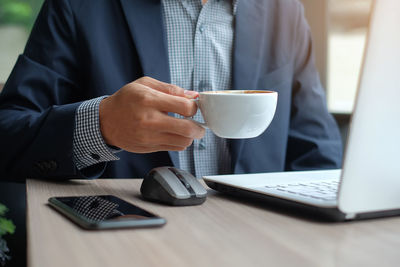 Man using laptop on table