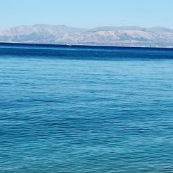 Scenic view of sea against blue sky