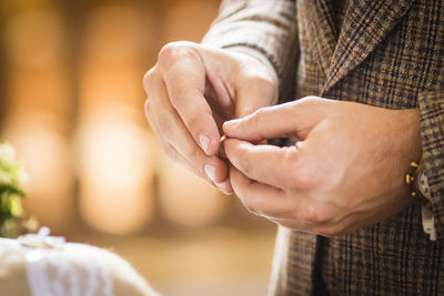 Close-up of couple holding hands