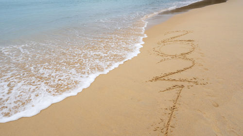 High angle view of heart shape on beach