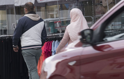 Rear view of man and woman on street