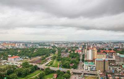 High angle view of buildings in city against sky