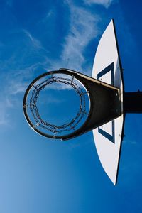 Basketball hoop and blue sky on the street