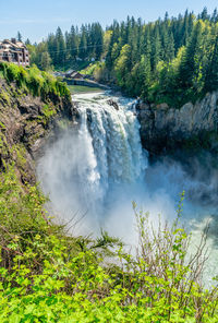 A view of snoqualmie falls on a powerful day in washington state.