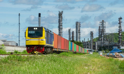 Train on field against sky