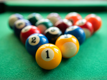 Billiard balls are in the triangle on the green table. concept of billiard, pool or snooker matches
