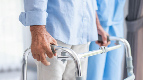 Midsection of man washing hands