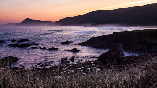 Scenic view of sea against sky during sunset