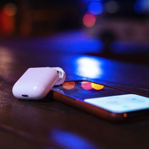 Close-up of smart phone on table at night