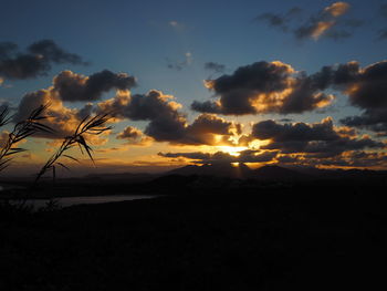 Scenic view of dramatic sky at sunset