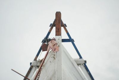 Low angle view of man against cloudy sky