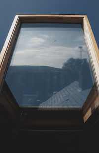 Reflection of sky on glass window