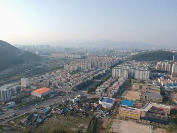High angle view of buildings in city against clear sky